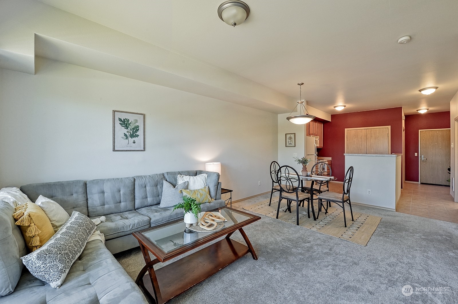 a living room with furniture and a table