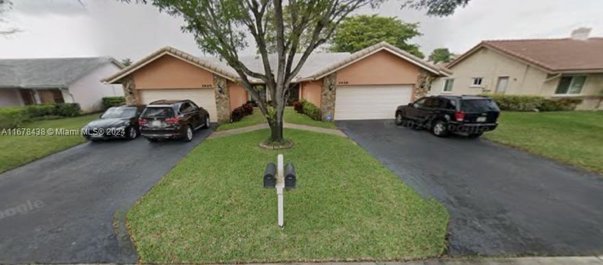 a view of a car parked in front of a house