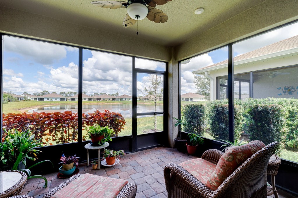 a living room with furniture and garden view