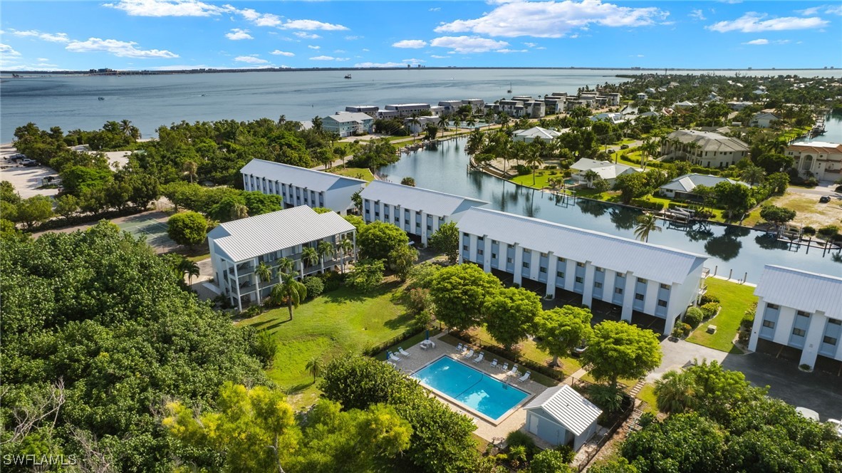 an aerial view of a house with a lake view