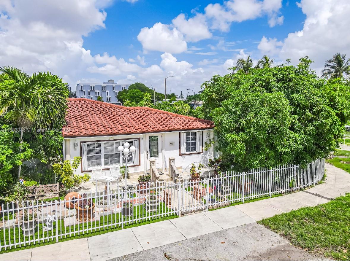 a house view with a sitting space and garden