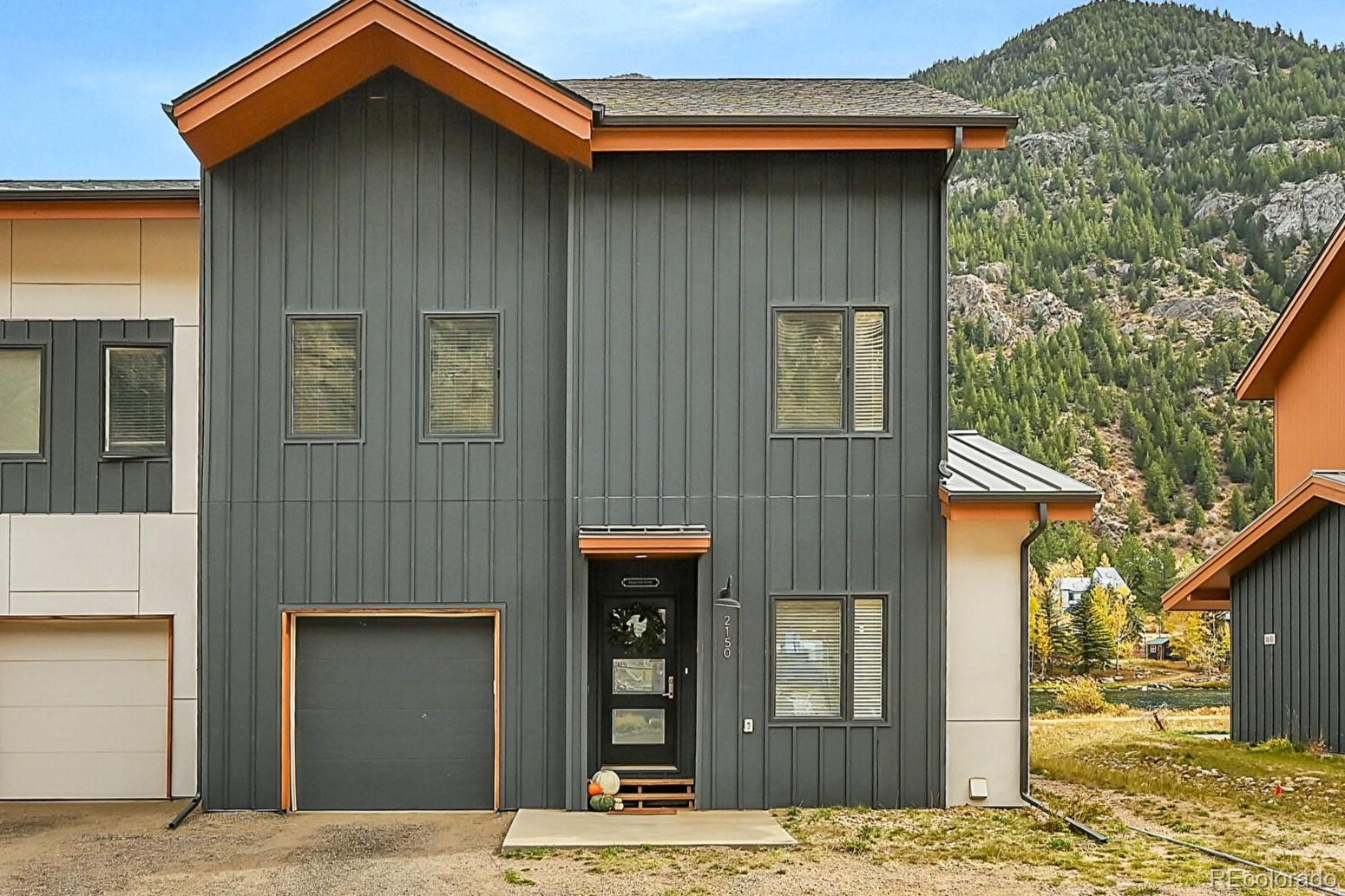 a view of a house with wooden fence