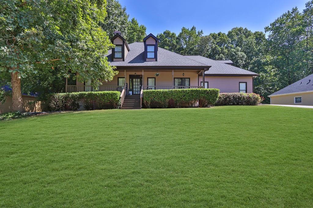 a front view of a house with a yard