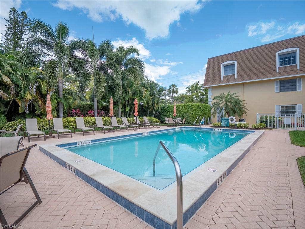 a view of a swimming pool with a patio