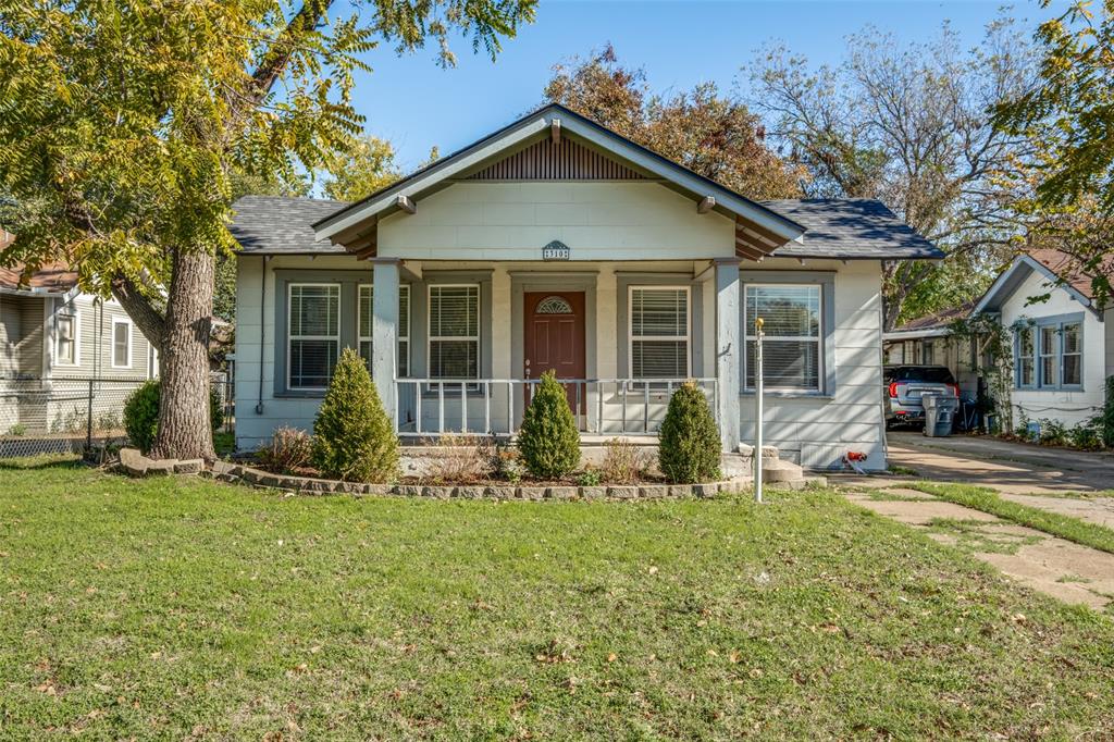 Bungalow-style home with a front yard and a porch