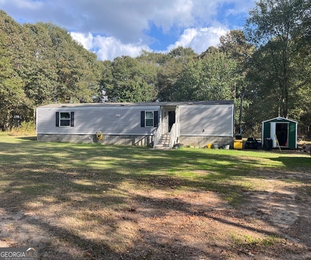 a view of a house with a big yard