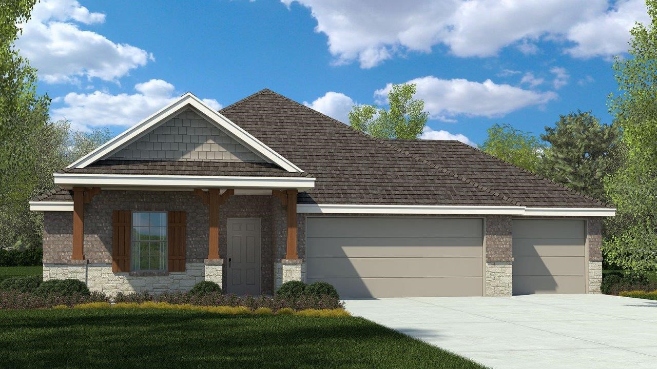 a front view of a house with a yard garage and outdoor seating