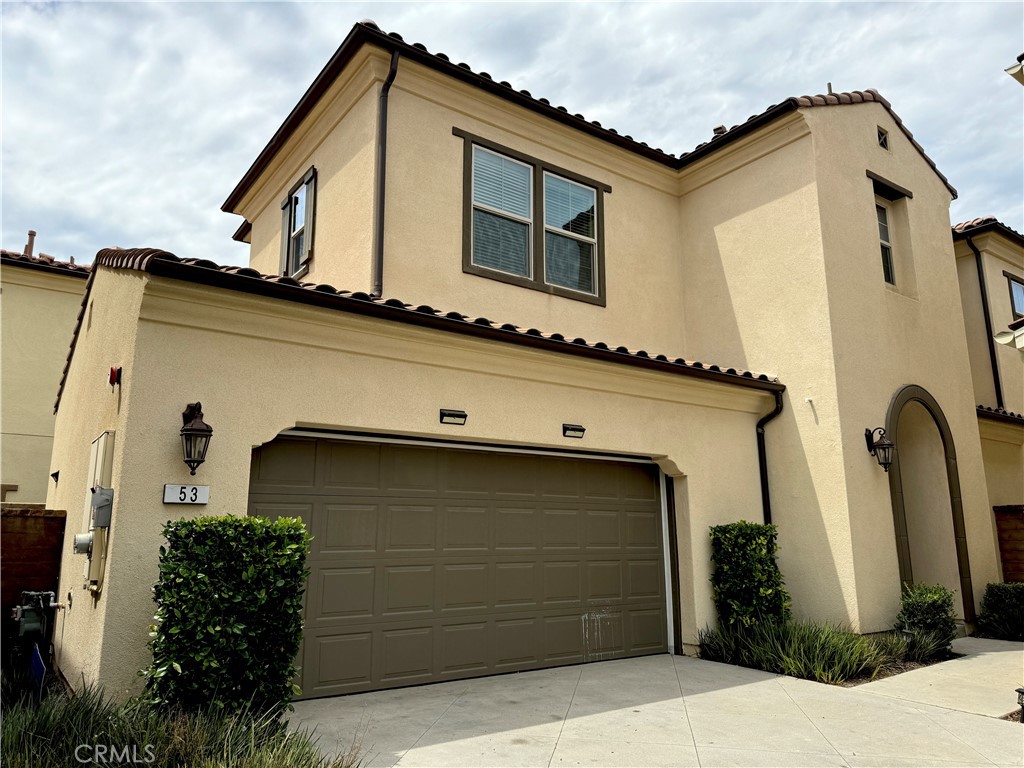 a front view of a house with garage