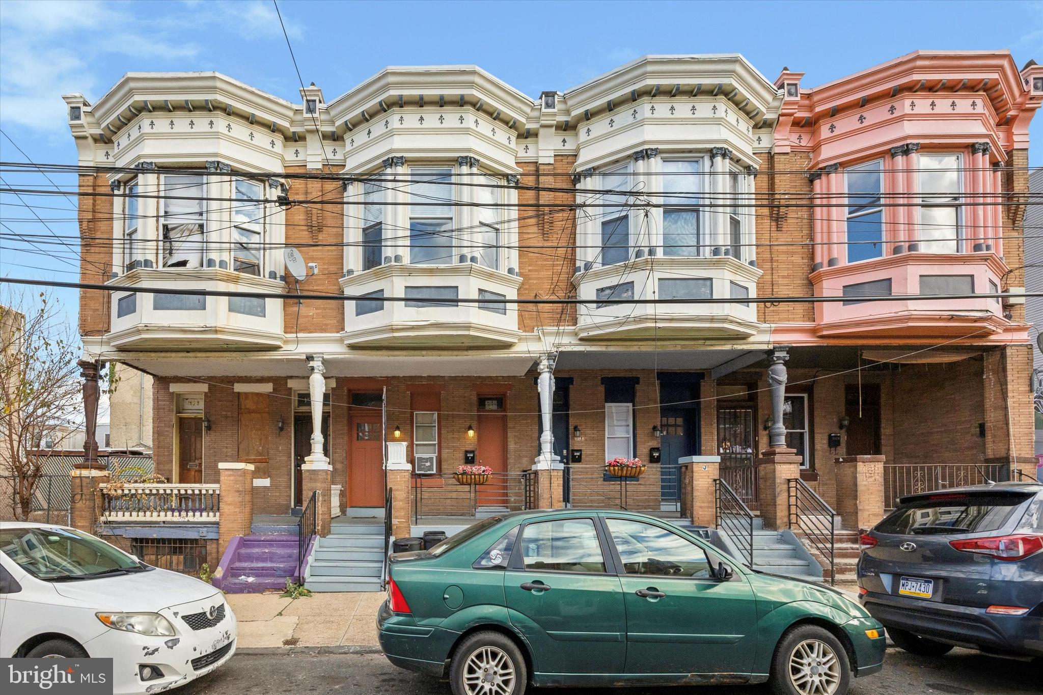 a front view of a house with parking space