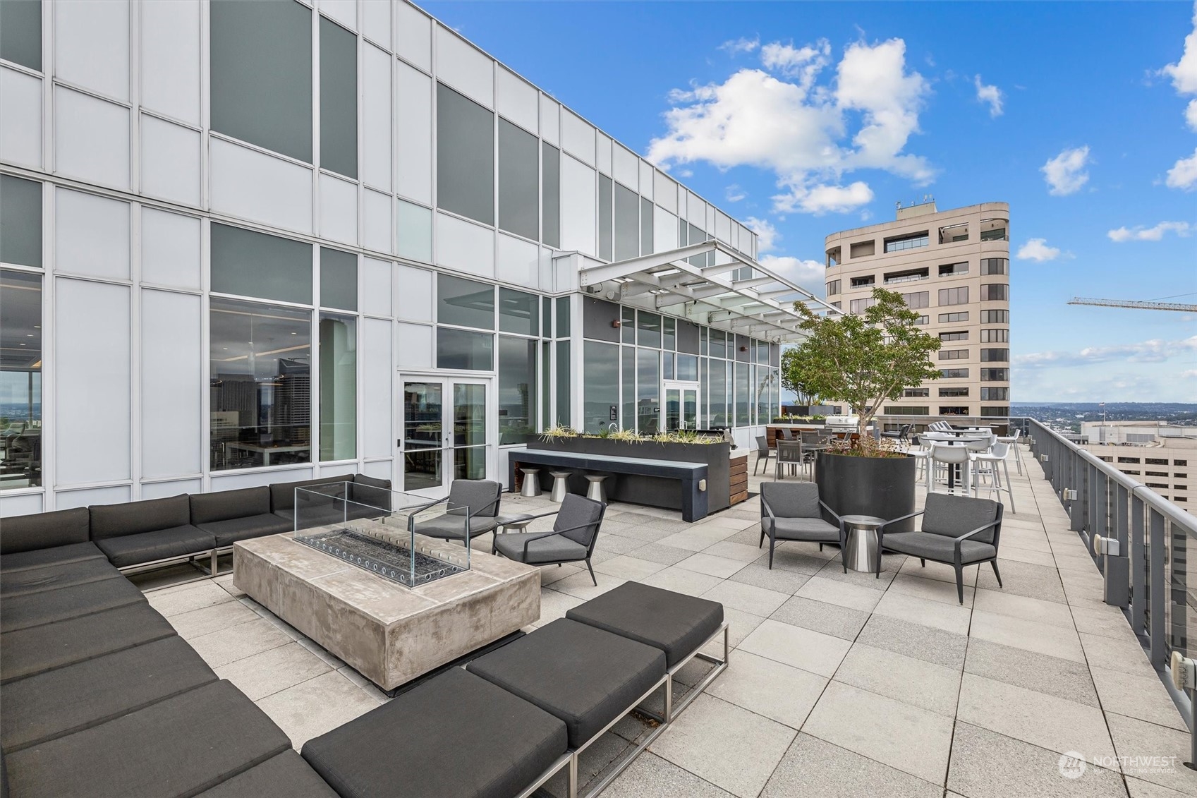 a view of a patio with couches and potted plants