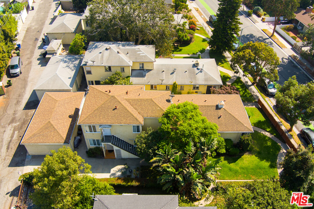 an aerial view of a house with a yard and garden