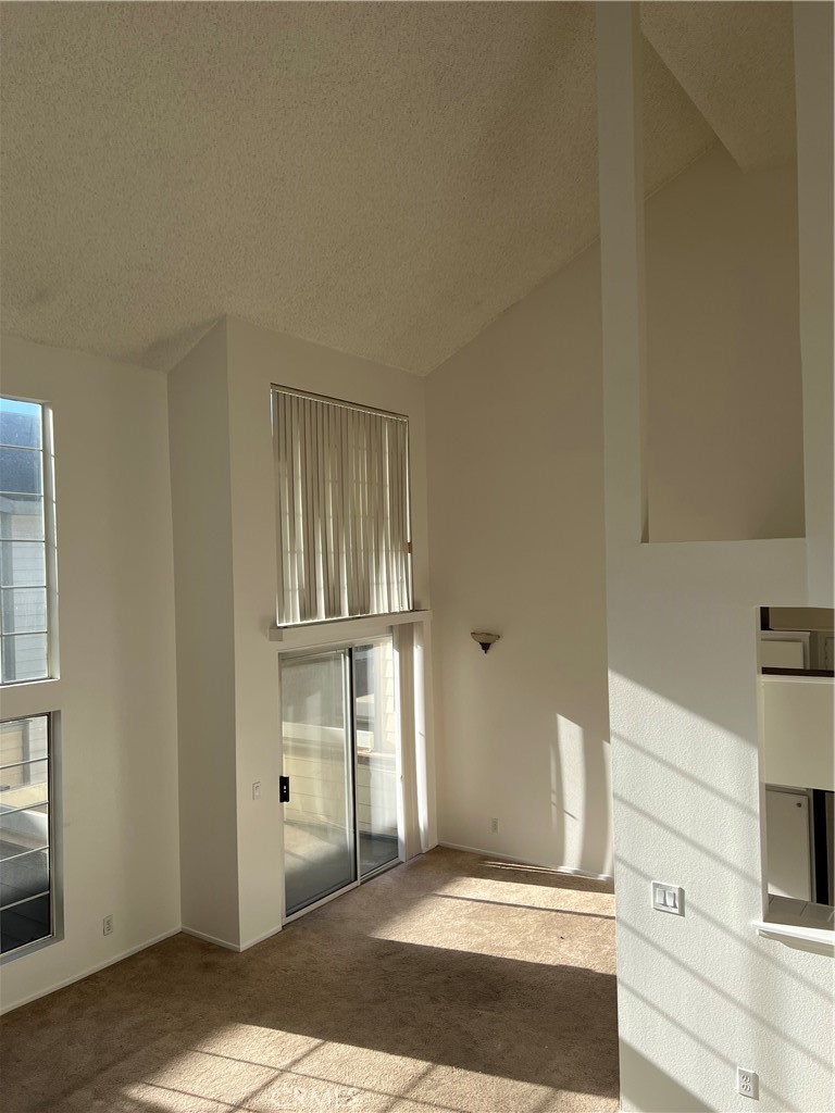 a view of a livingroom with wooden floor and cabinet