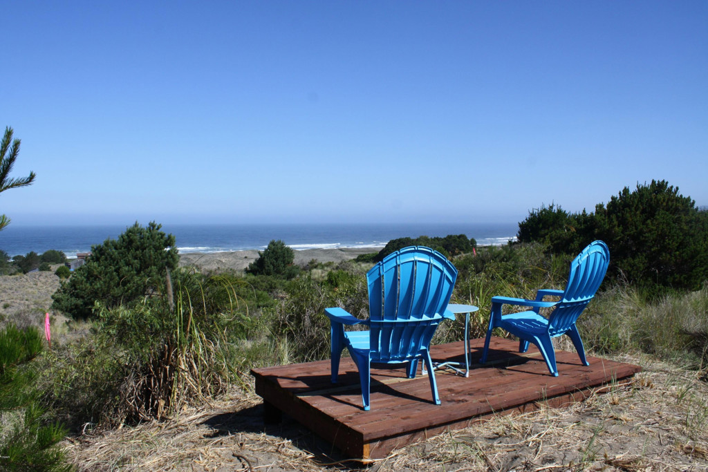 a view of a chairs and table in patio