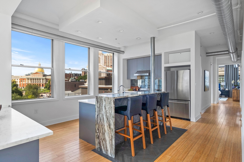 a dining room with furniture window wooden floor