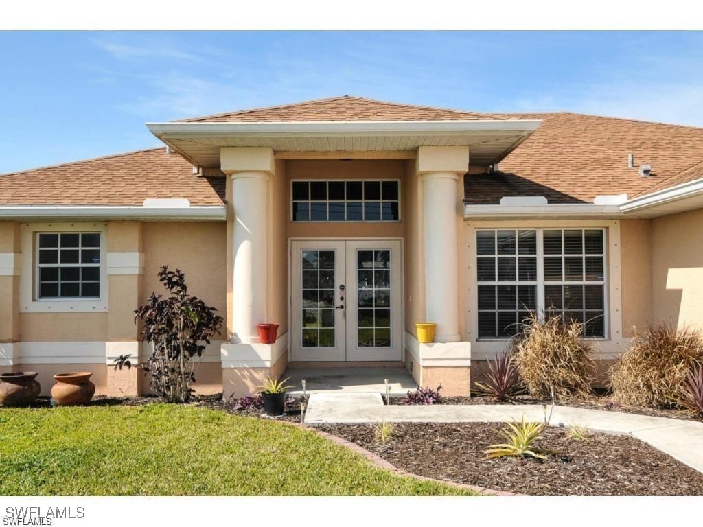 a front view of a house with a yard