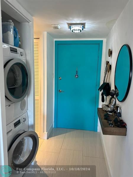 a view of a kitchen with washer and dryer