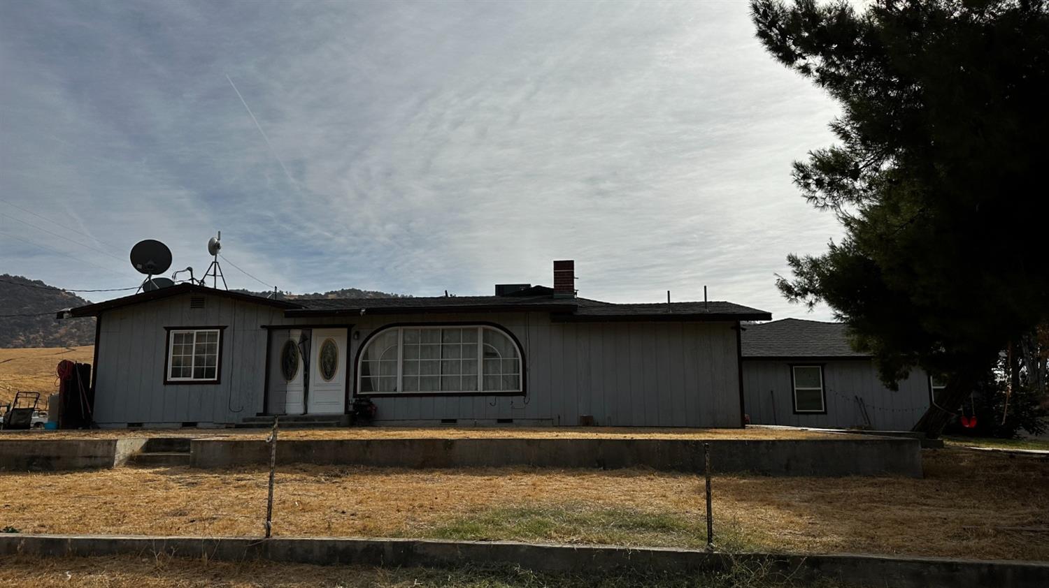 a front view of a house with garage