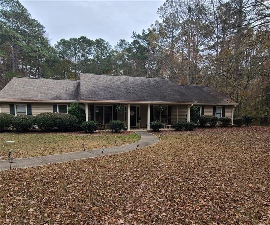 a front view of a house with a yard and a garage