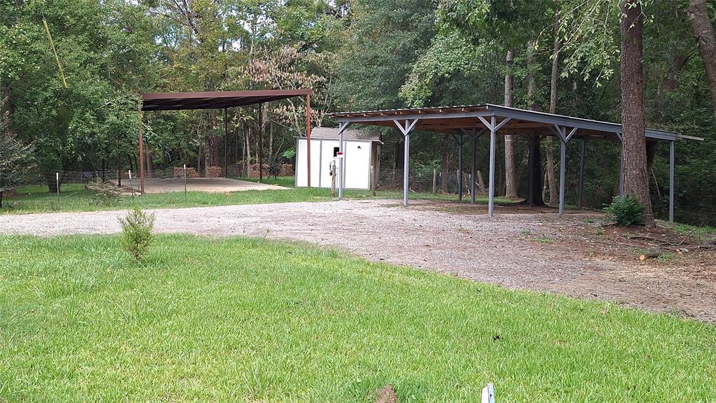 a view of a house with backyard and porch