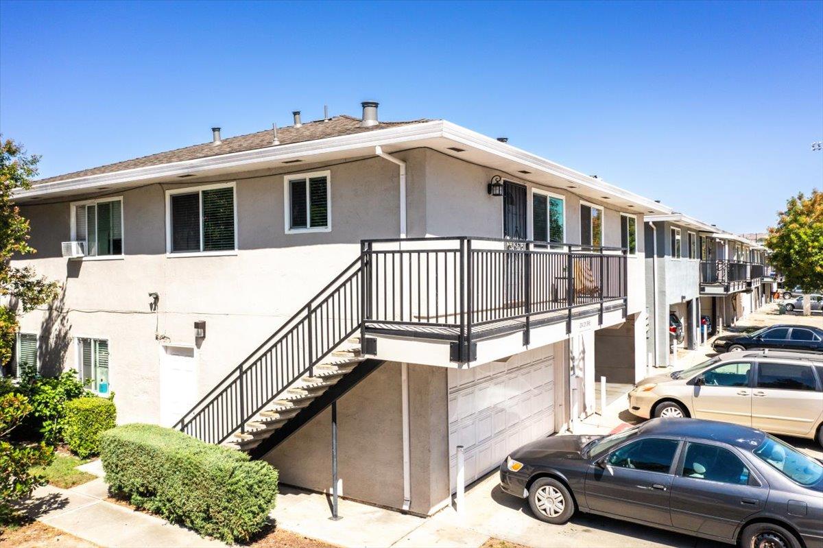 a view of a car park in front of a house