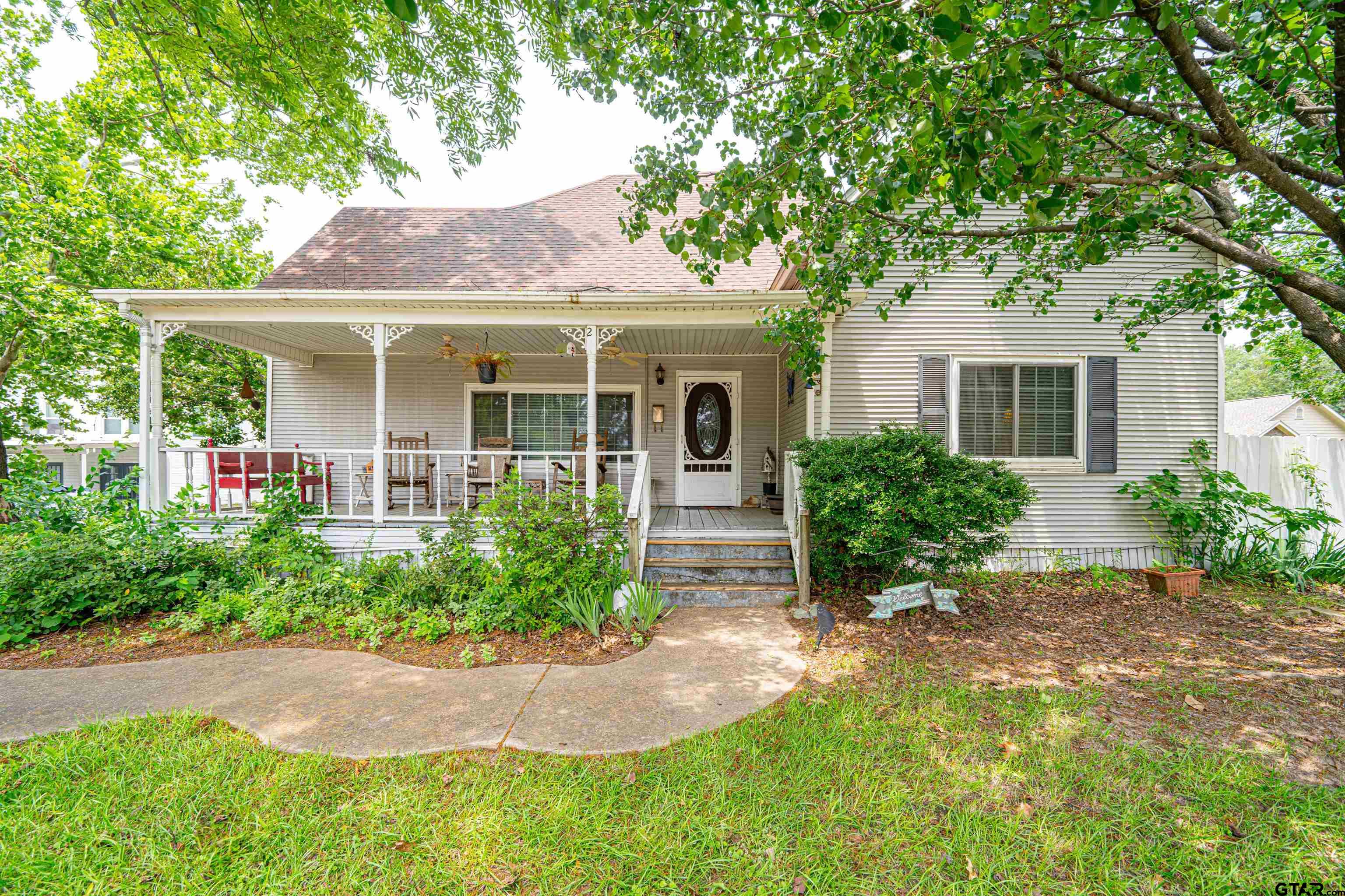 front view of a house with a yard