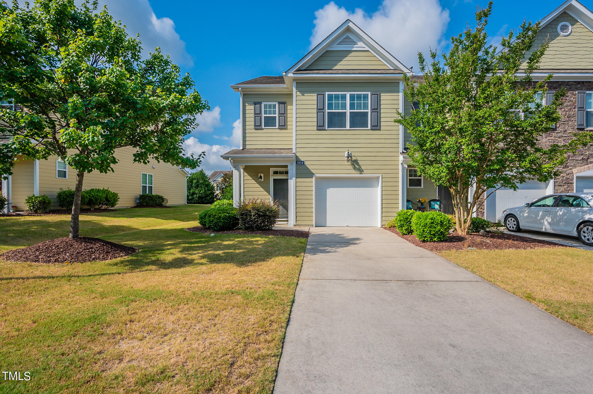 a front view of a house with a yard