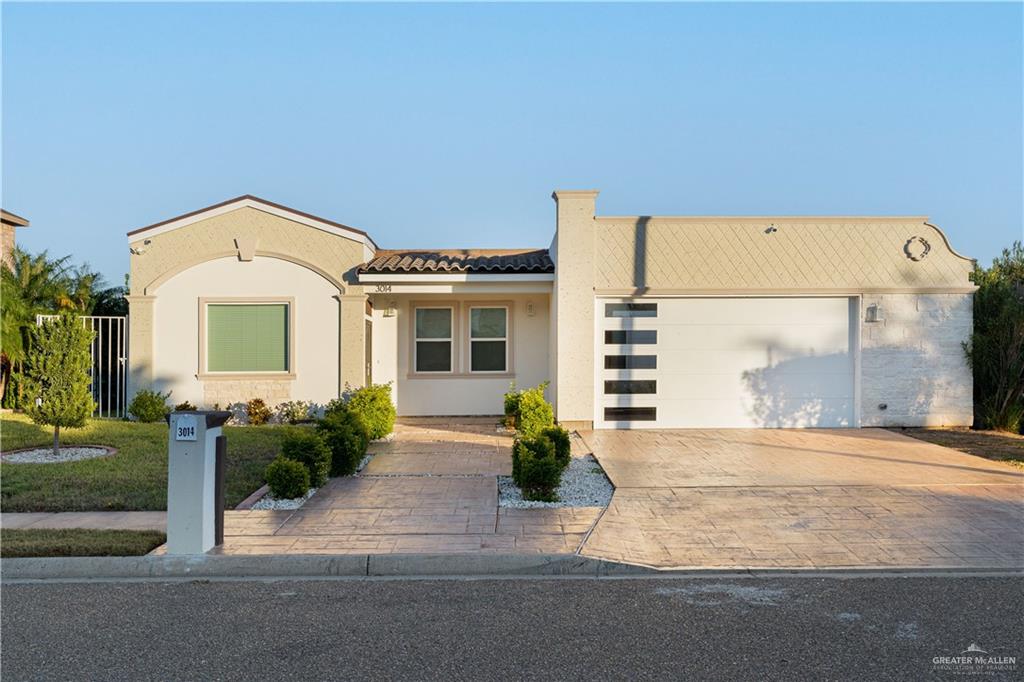 View of front of home featuring a garage