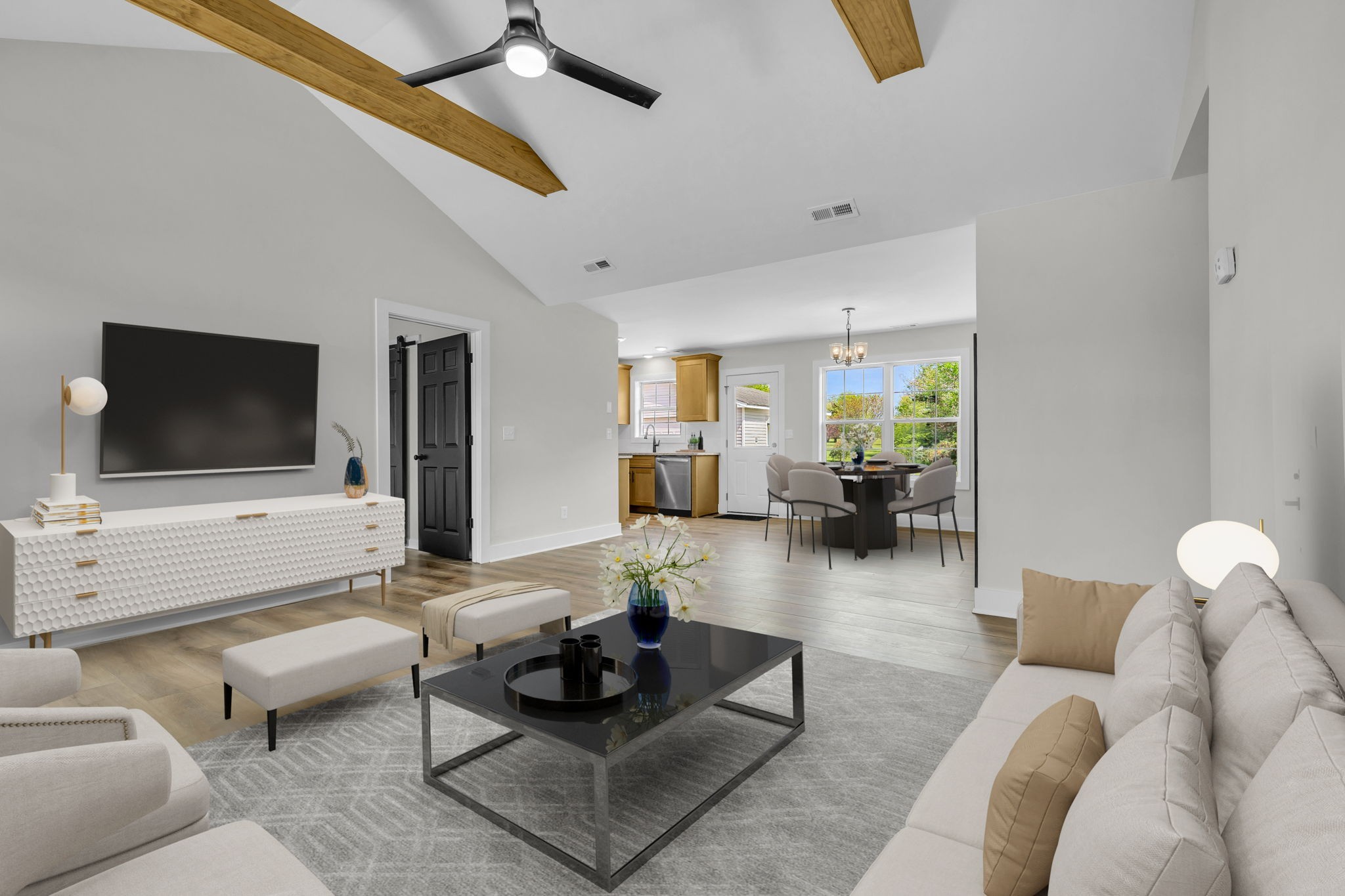 a living room with furniture and a flat screen tv