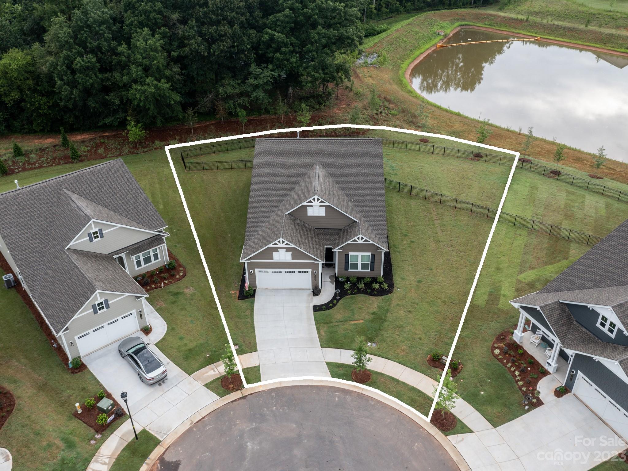 a view of a swimming pool with a yard