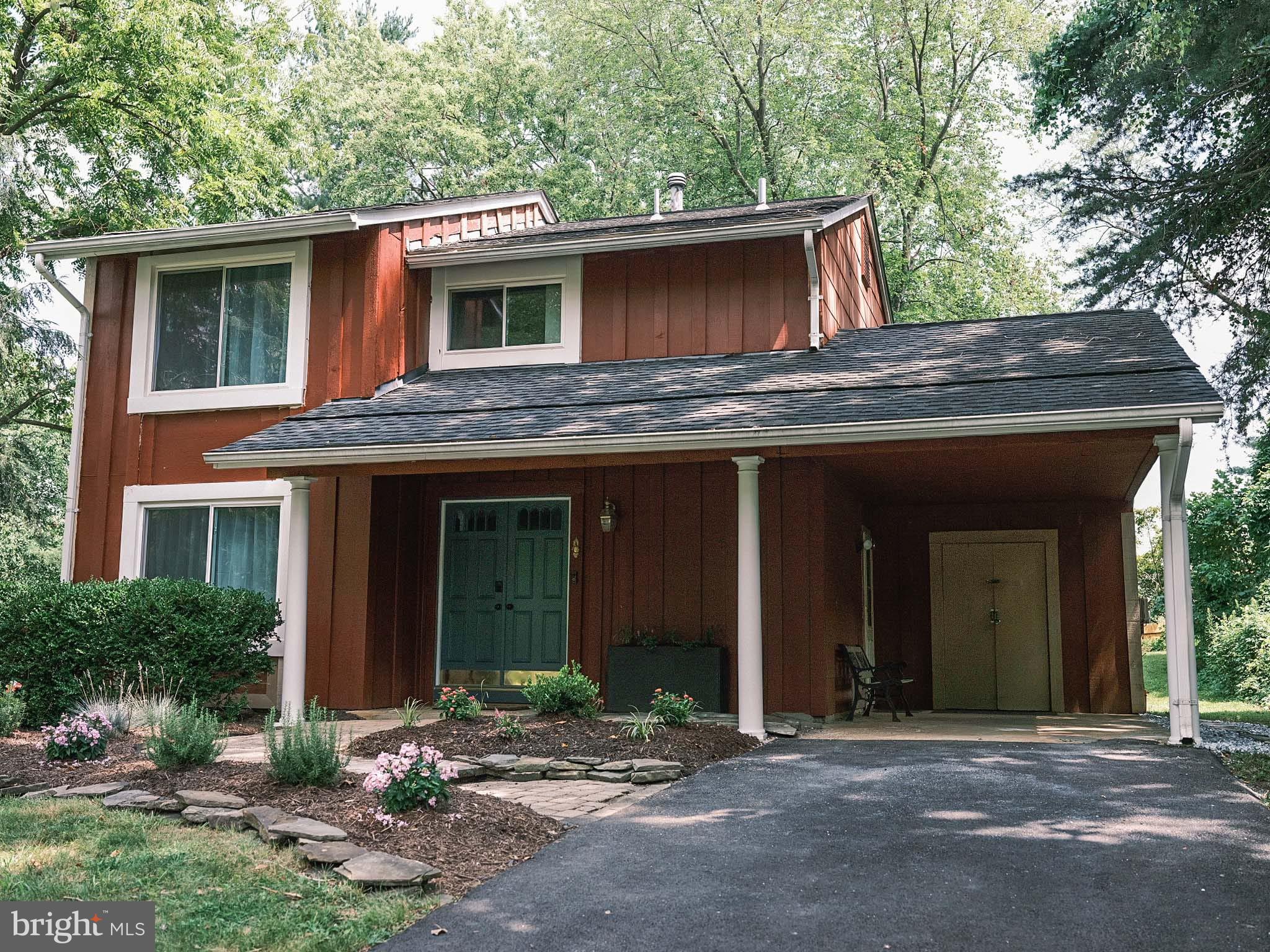 a front view of a house with yard