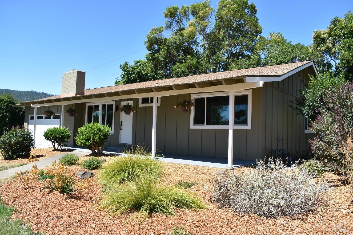 front view of a house with a yard