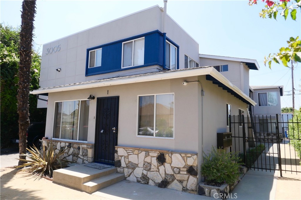 a front view of a house with parking