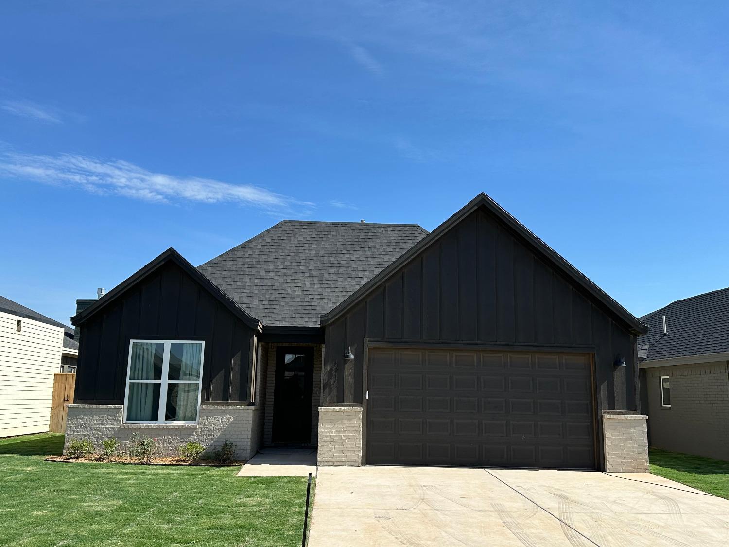 a front view of house with yard