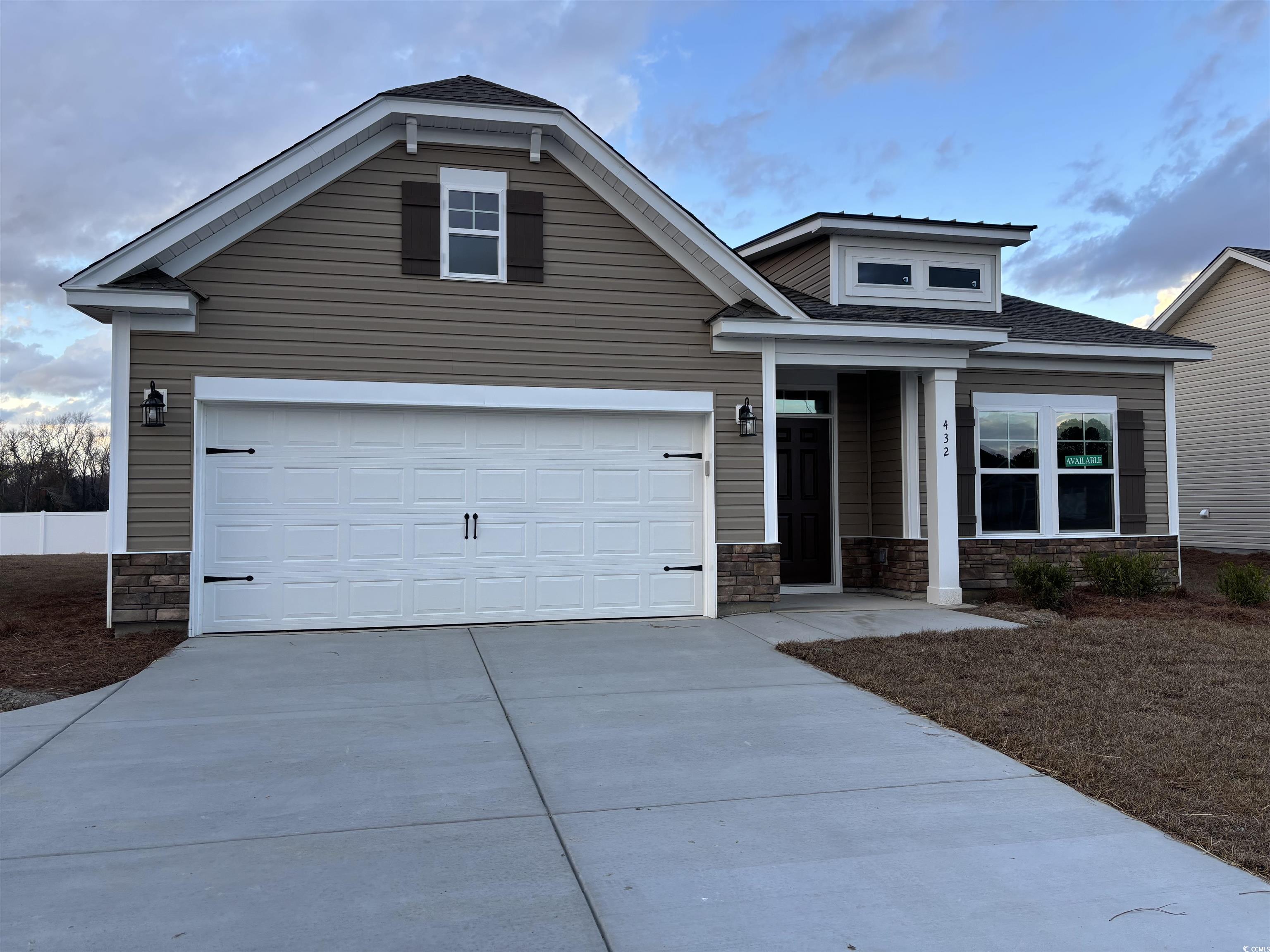 Craftsman inspired home featuring a garage