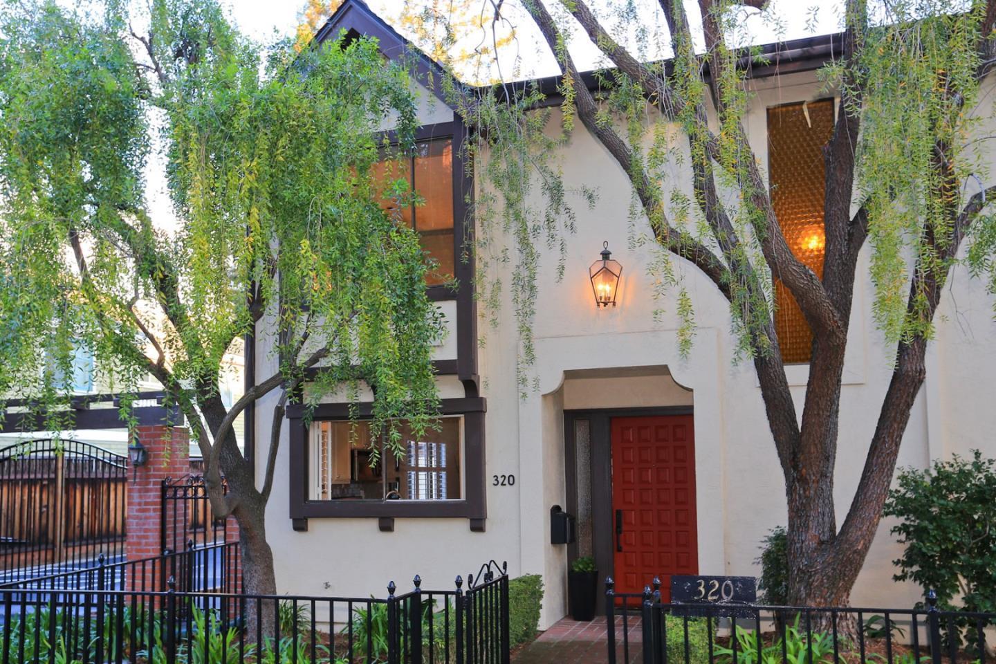 a view of a house with a tree