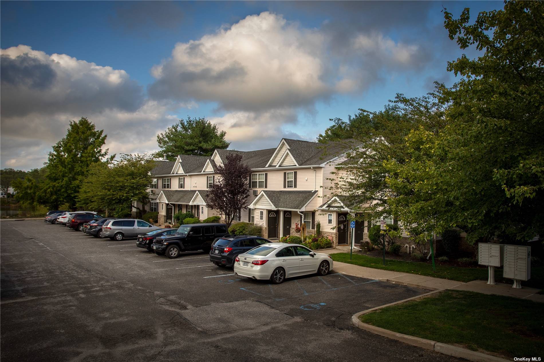 a view of street with parked cars