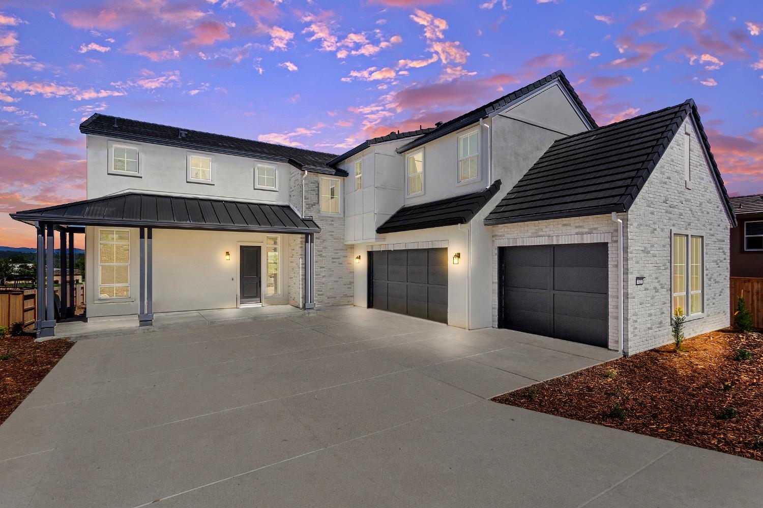 a front view of a house with a garage