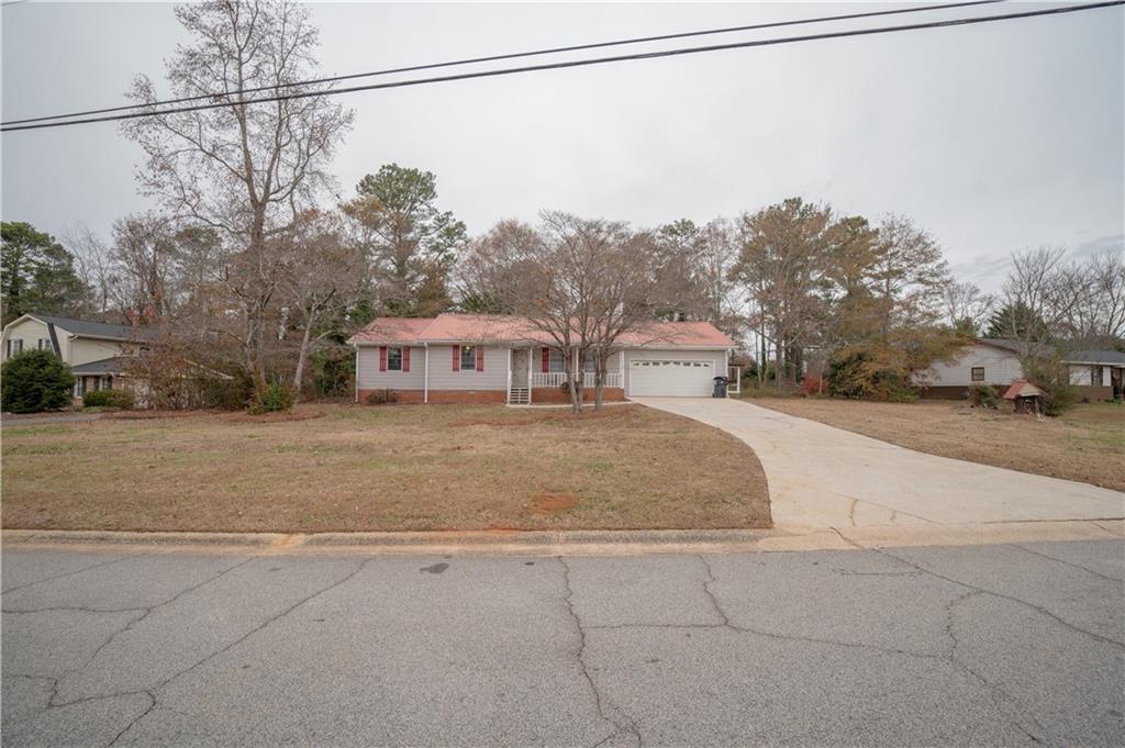 a view of a house with a street