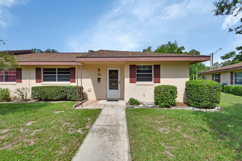 front view of a house with a yard