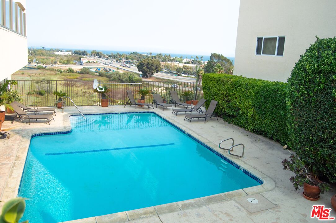 a view of a swimming pool with a lake view