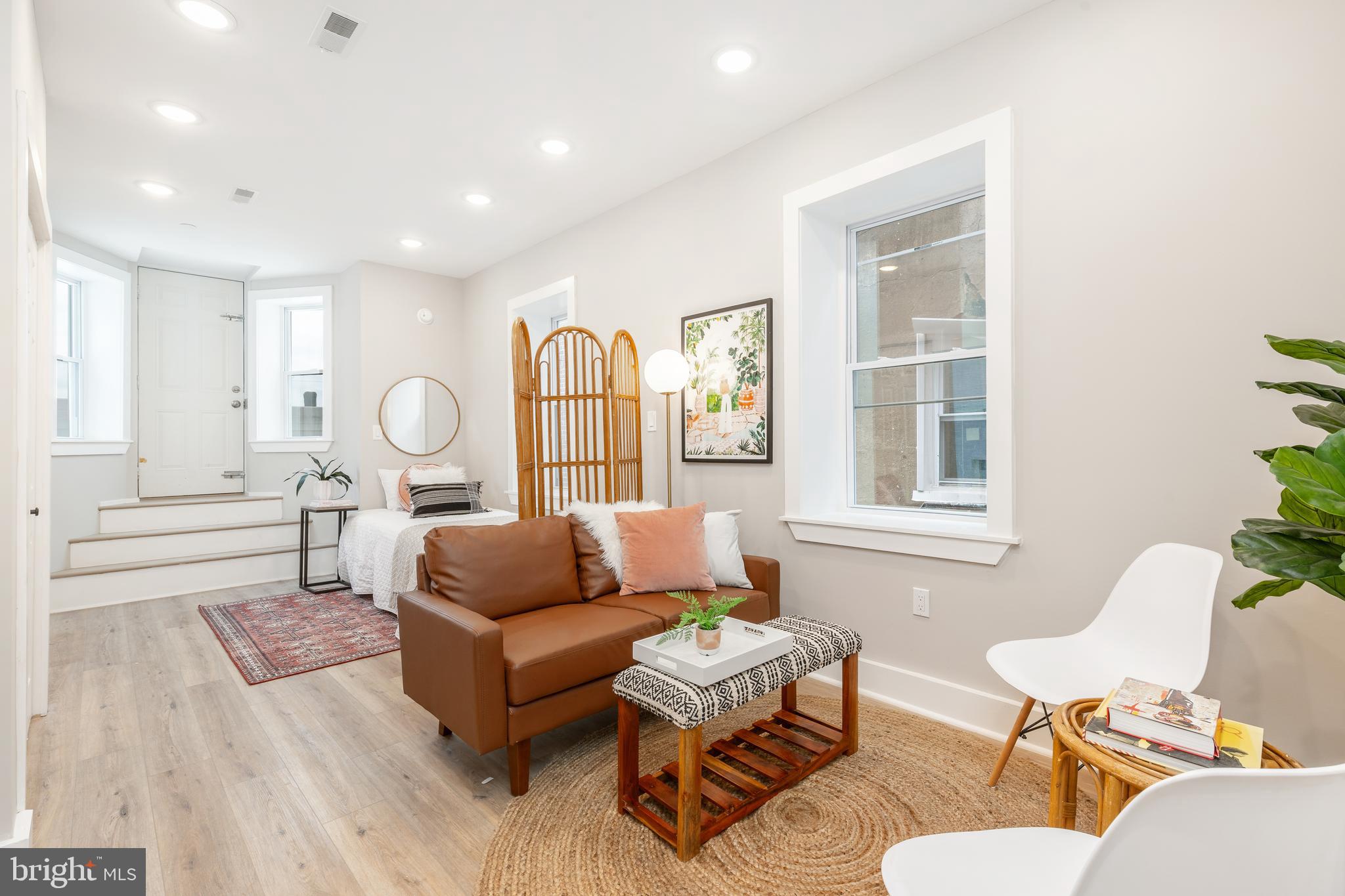 a living room with furniture and windows