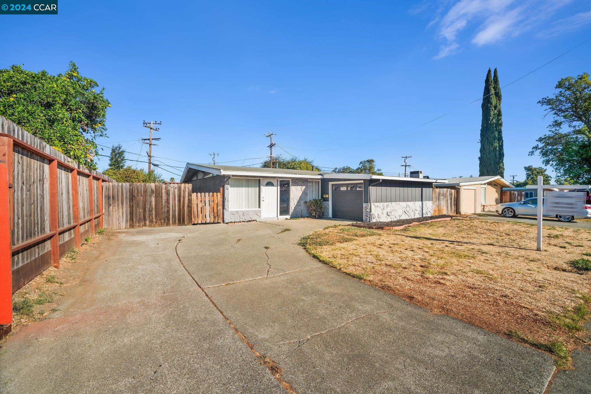 a house view with a backyard space