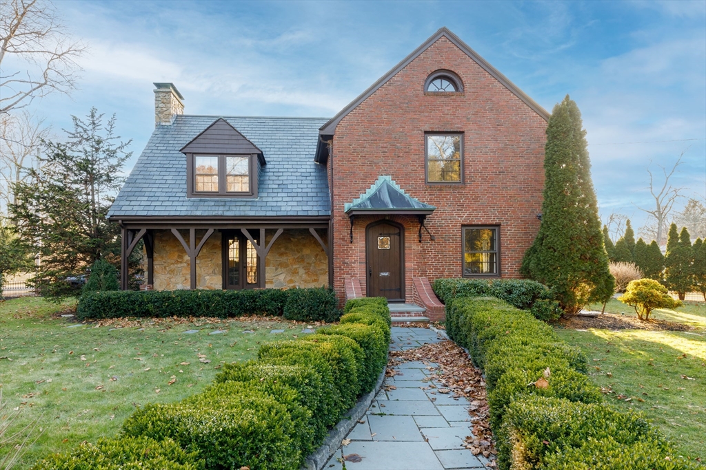 a front view of a house with garden