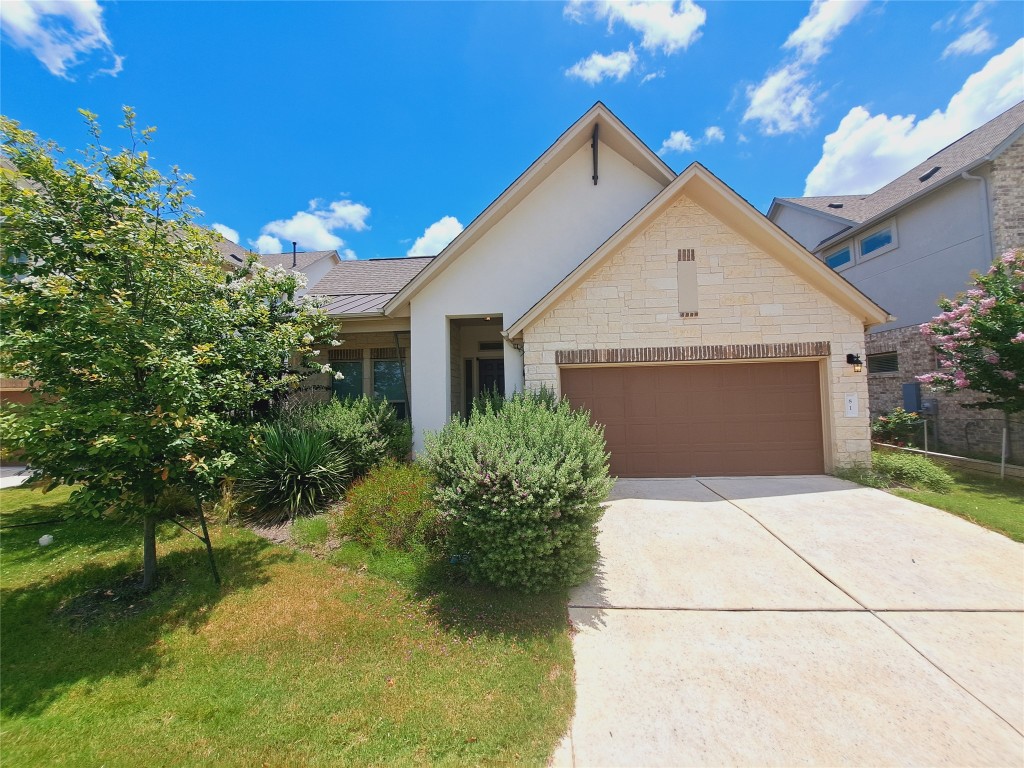 a front view of house with garden