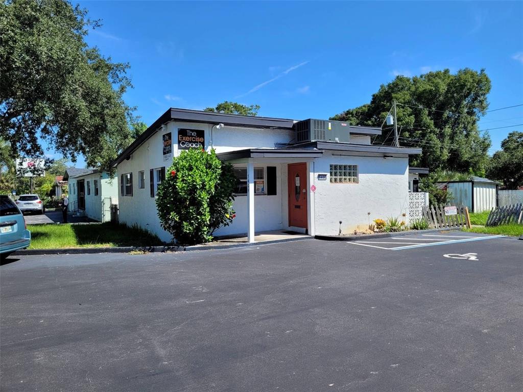 a view of a house with a yard and garage