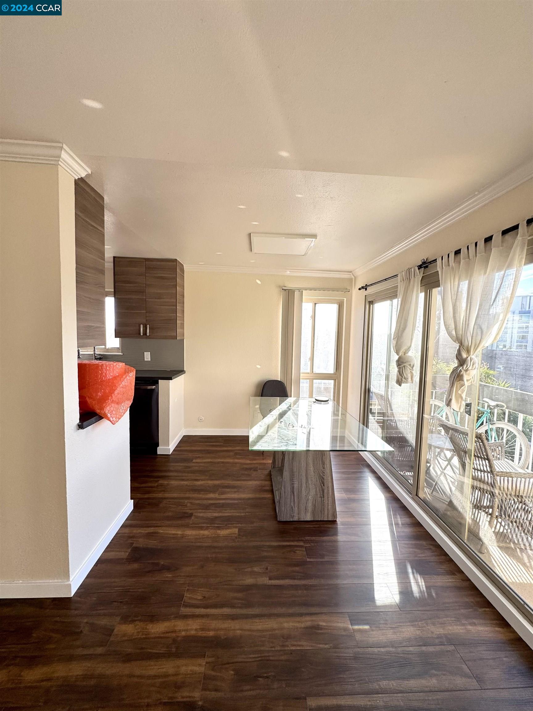 a view of kitchen with furniture and wooden floor