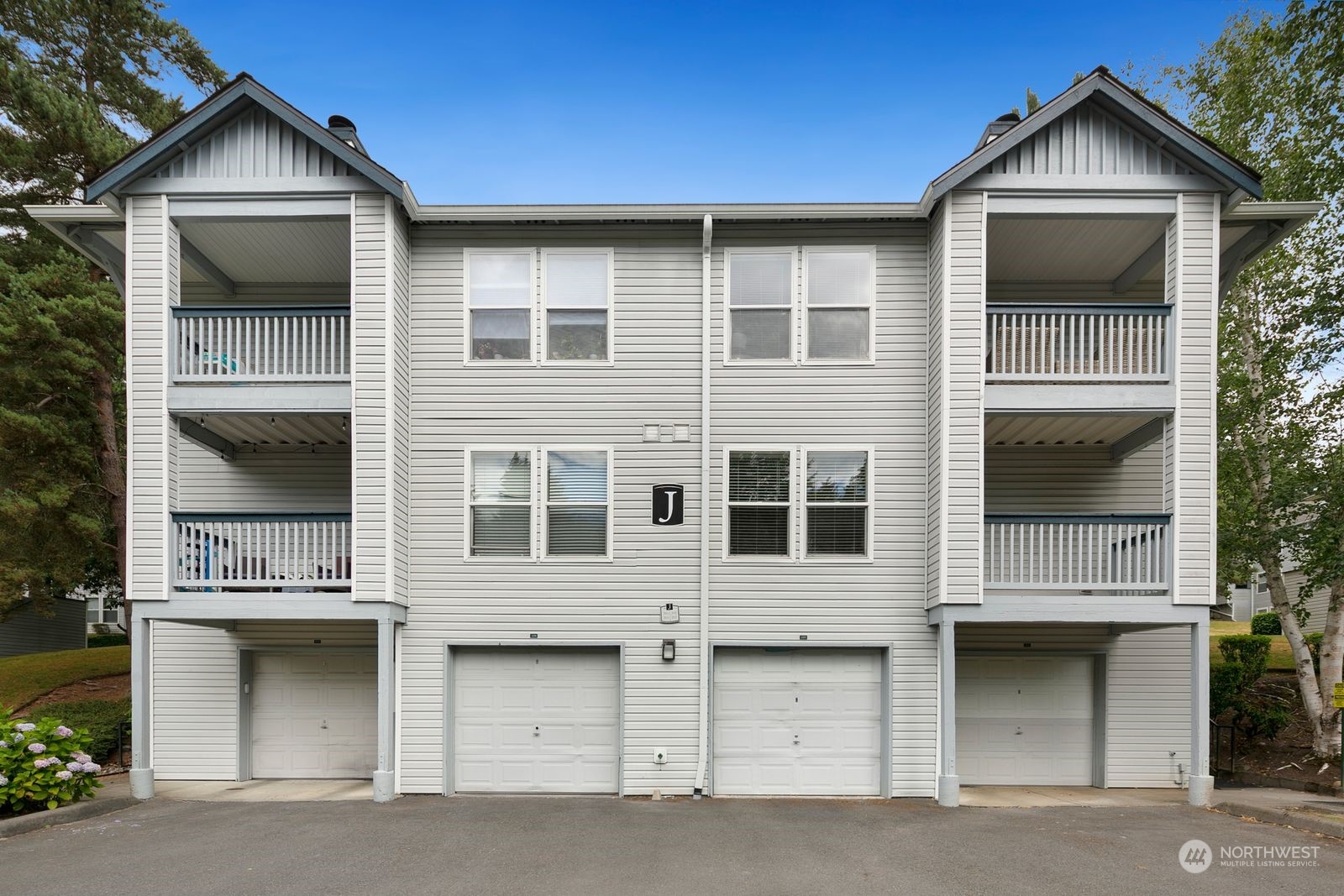 a front view of a house with a garage