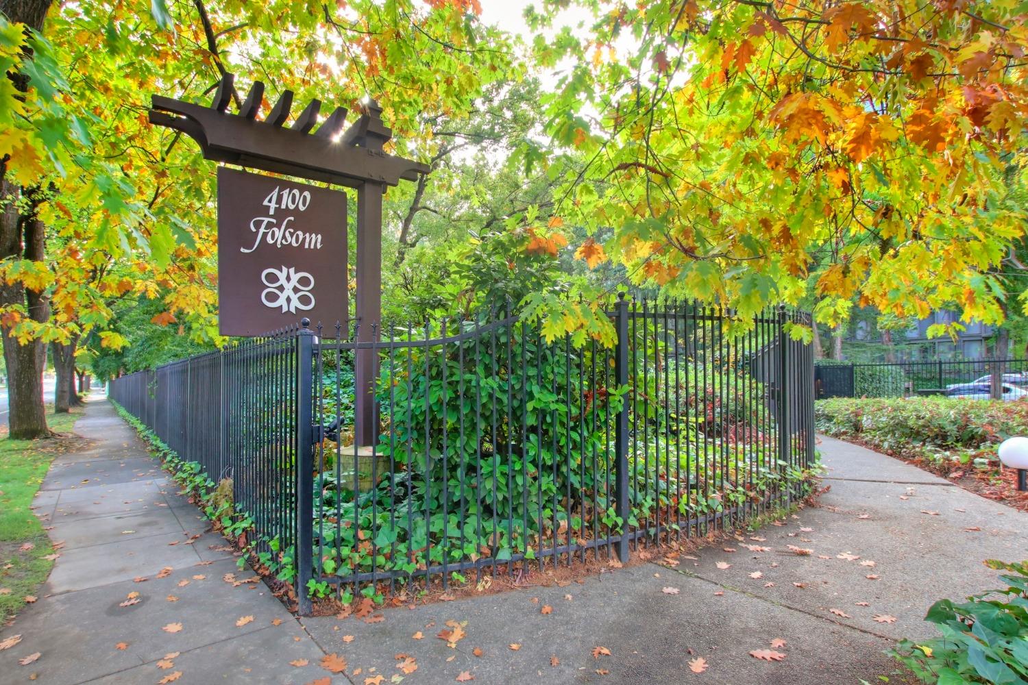 a sign board with yard in the back