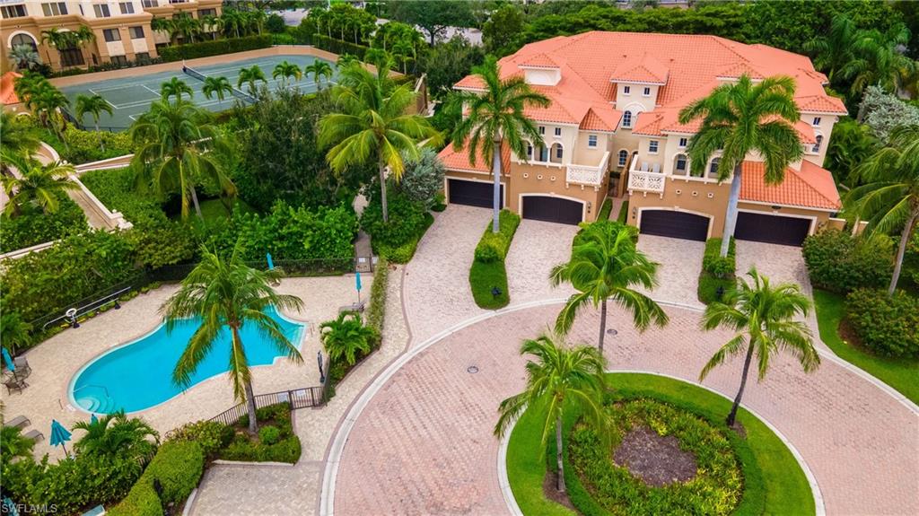 an aerial view of a house with a garden and swimming pool