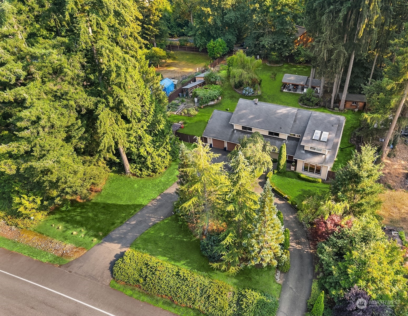 an aerial view of a house with a garden